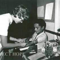Susan Willson, Medical Technologist, draws blood from patient.